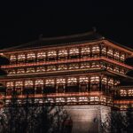 lights on the drum tower of xi an during night time