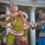 three woman performing traditional dance