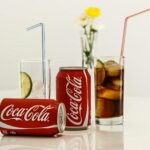 Coca Cola Cans and Glasses With Lines