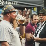 Man Drinking from a Beer Pint