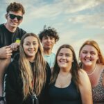 photography of five people near outdoor during daytime