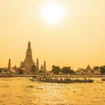 people walking on bridge over body of water during daytime