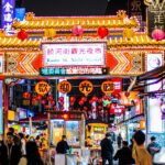 people walking on street during night time