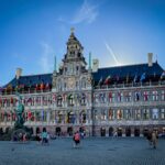 a large building with a statue in front of it