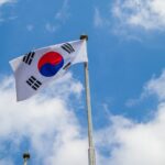 white red and blue flag under blue sky during daytime