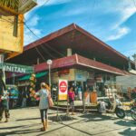 Lively street market scene in Dumaguete City, showcasing local vendors and vibrant culture.